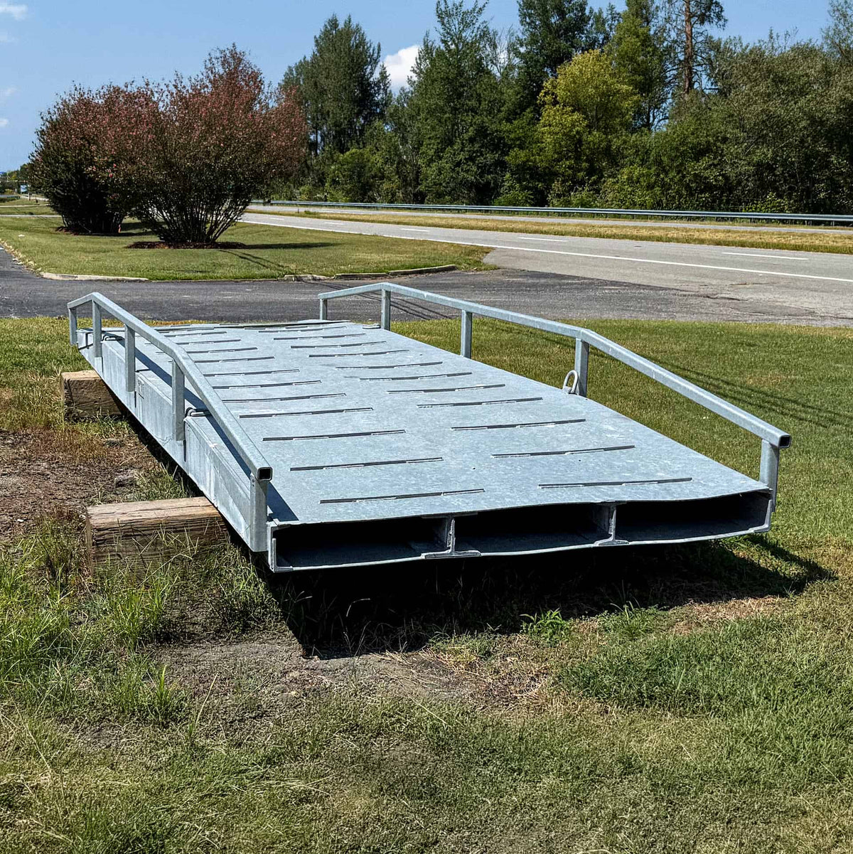 Used 20-foot steel ATV bridge, angled view of the deck and side rails