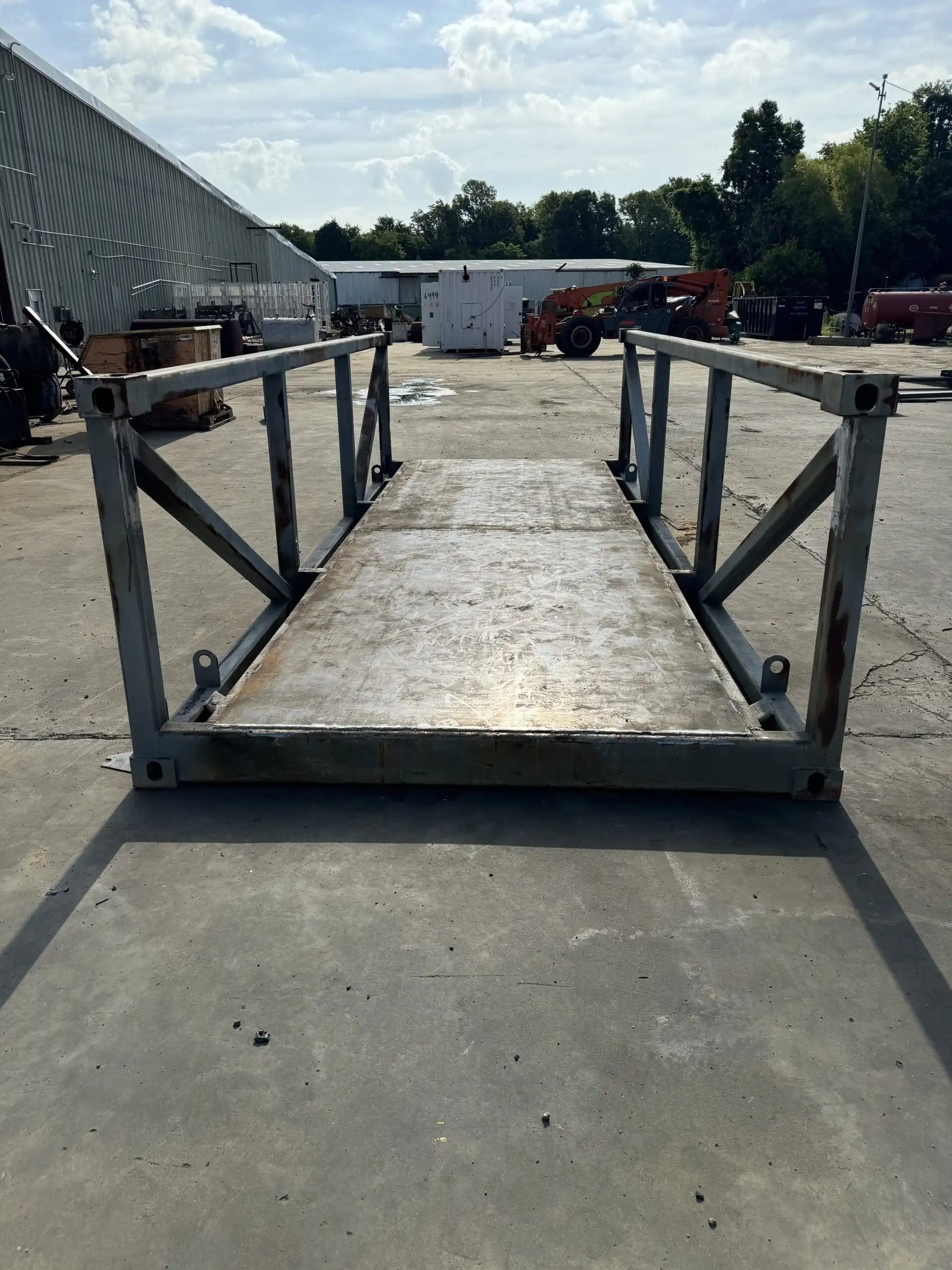 portable steel pedestrian bridge in an industrial lot