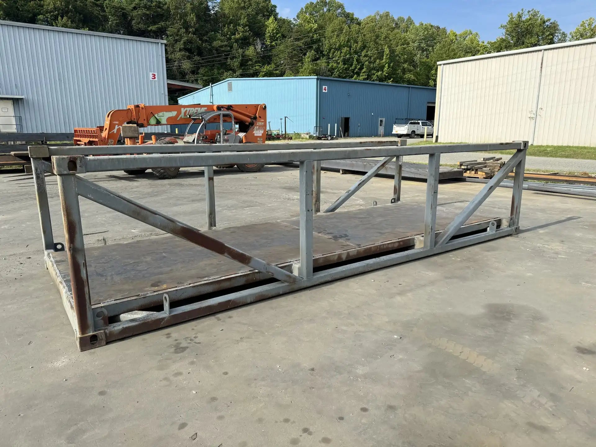 portable steel pedestrian bridge in an industrial lot