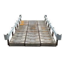 portable steel bridge with tire treads and railings on a white background