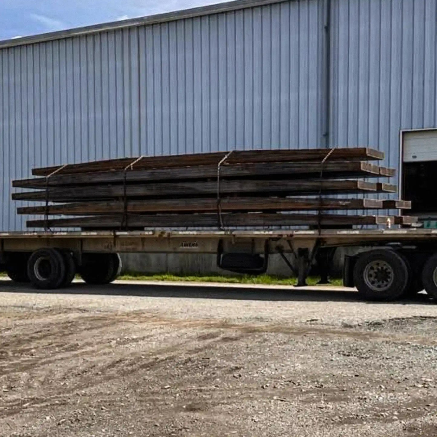 a trailer with portable steel bridge components on it