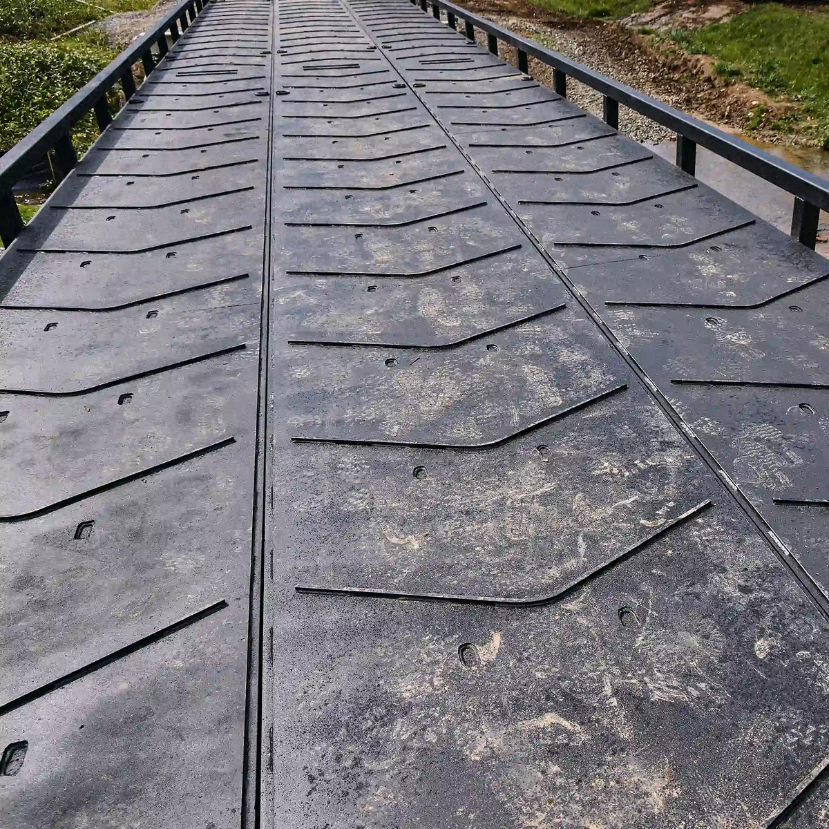 Close-up of anti-skid steel bridge deck panels on a modular vehicle bridge