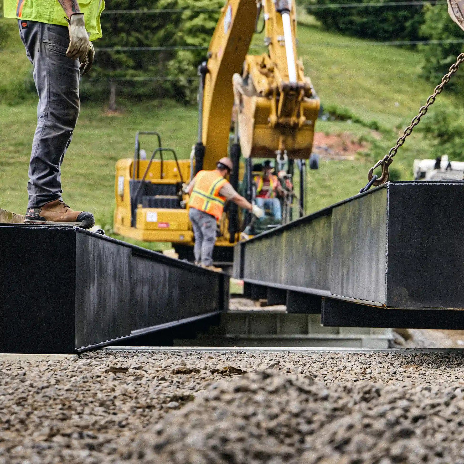 Modular bridge section being set onto a concrete abutment