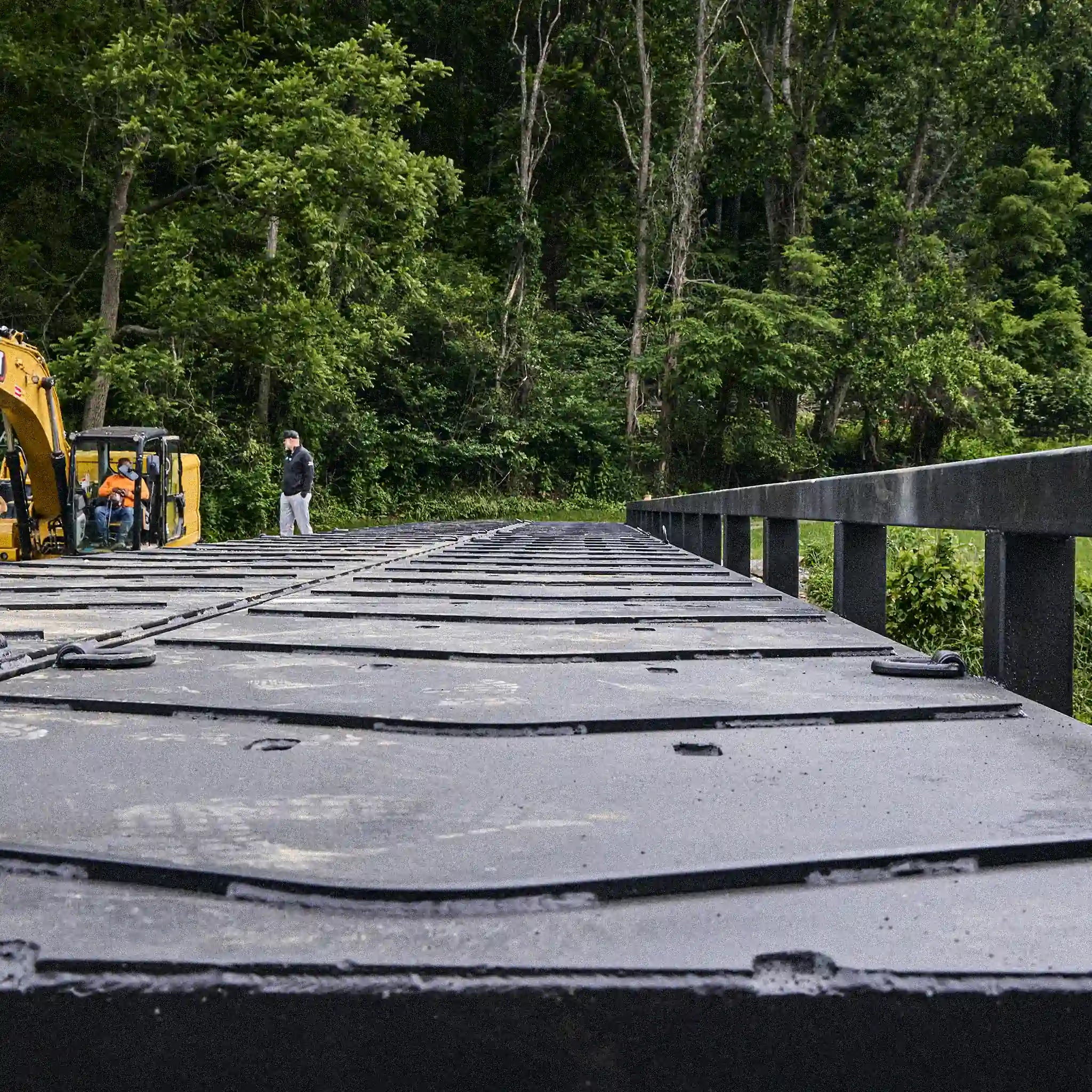 View along a modular steel bridge deck with anti-skid panels