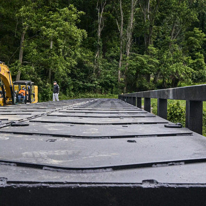 View along a modular steel bridge deck with anti-skid panels